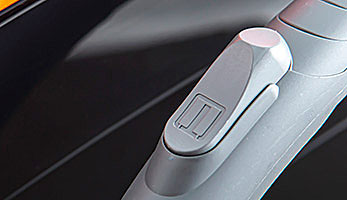 Grey hose handle with a flap for mechanical suction power adjustment